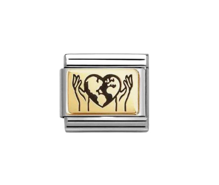 Gold and silver charm with a design of hands holding a heart on a white background