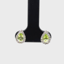 Load and play video in Gallery viewer, 9ct White Gold Pear Shaped Peridot And Diamond Stud Earrings
