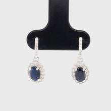 Load and play video in Gallery viewer, 9ct White Gold Oval Sapphire And Diamond Drop Earrings

