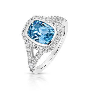 Halo Style Ring With Split Shoulder 9x7mm Pale Blue Cushion Cut Centre