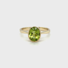Load and play video in Gallery viewer, 9ct Yellow Gold Oval Faceted Peridot Rub Over Setting Ring
