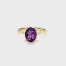 Load and play video in Gallery viewer, 9ct Yellow Gold Oval Faceted Amethyst Rub Over Setting Ring
